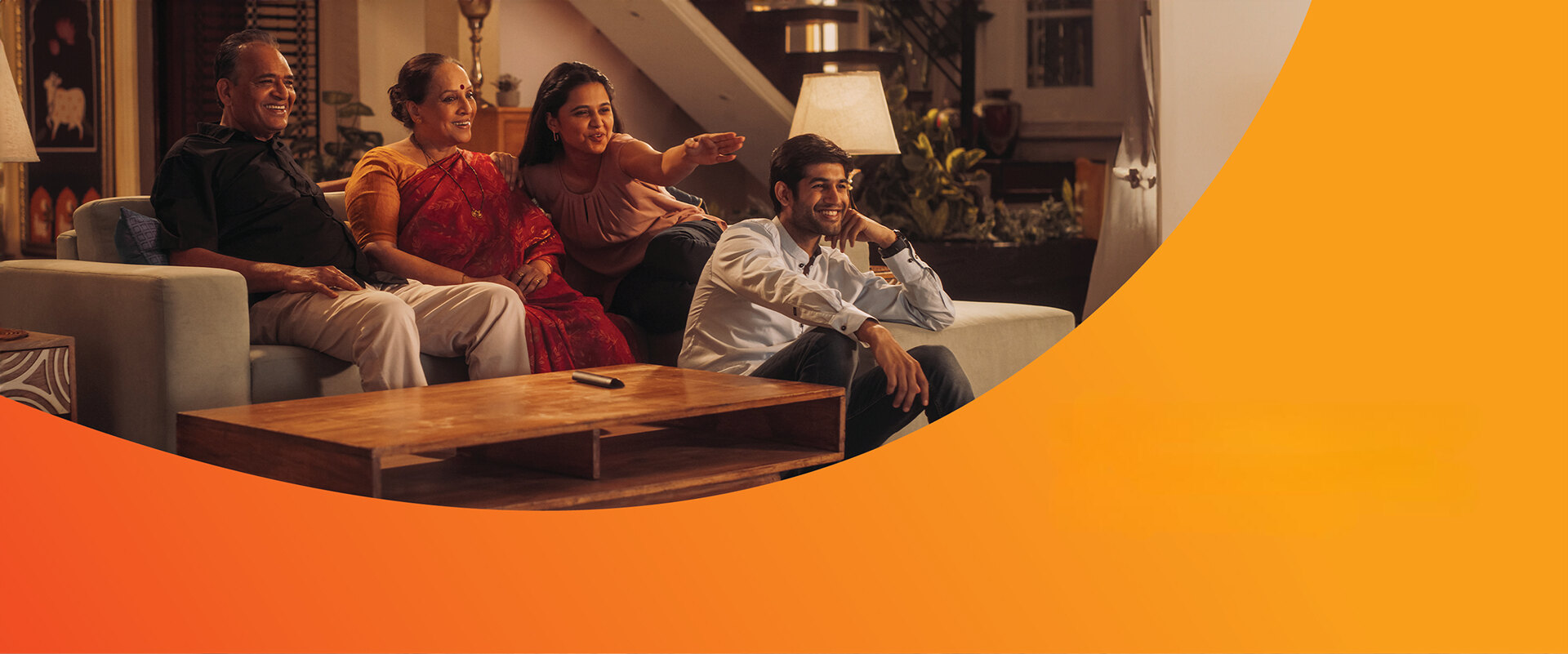 Indian family enjoying Chitram TV together at home